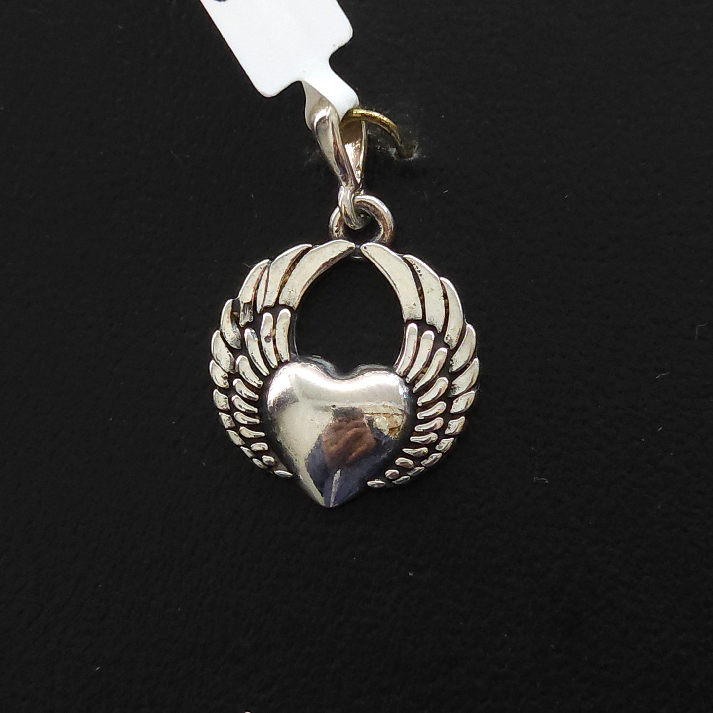 Dije de plata. Corazon con Alas