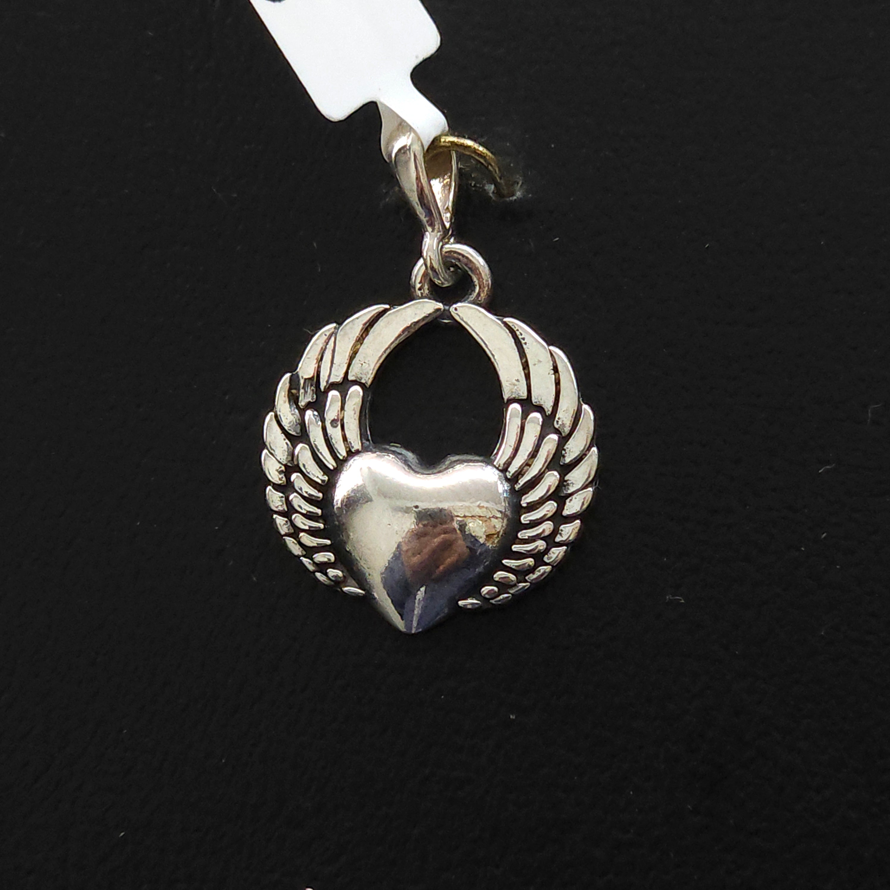 Dije de plata. Corazon con Alas